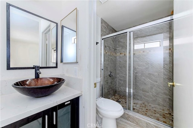 69645 Antonia Way, Rancho Mirage, CA 92270 - bathroom featuring toilet, a stall shower, and vanity