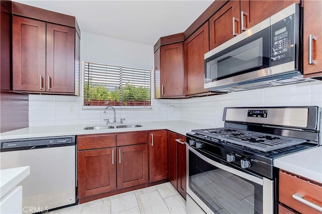 69645 Antonia Way, Rancho Mirage, CA 92270 - kitchen with stainless steel appliances, a sink, and light countertops