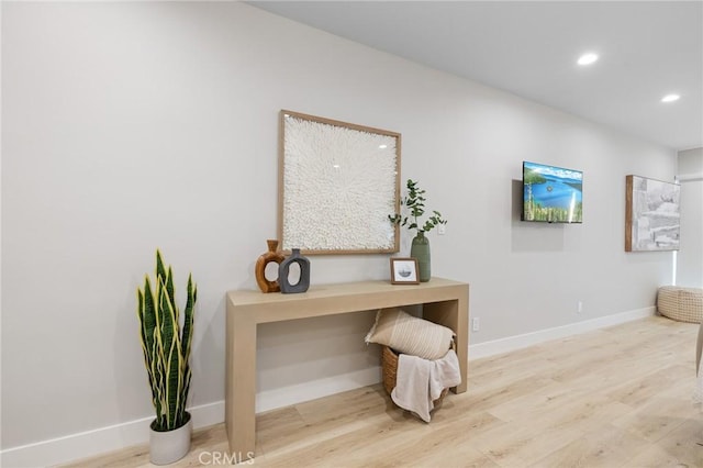 office space featuring recessed lighting, baseboards, and wood finished floors