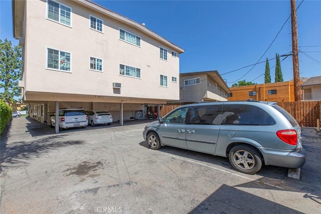 covered parking lot with fence