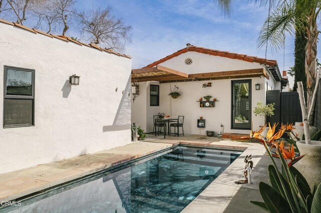 1241 Solita Rd, Pasadena, CA 91103 - back of property featuring a fenced in pool, fence, a patio, and stucco siding