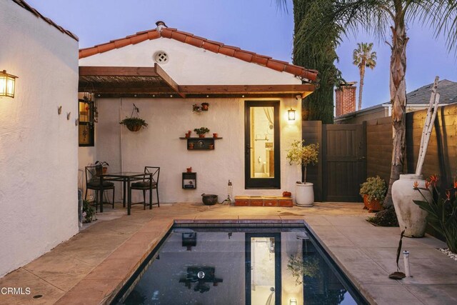 1241 Solita Rd, Pasadena, CA 91103 - back of property with fence, a fenced in pool, a patio area, and stucco siding