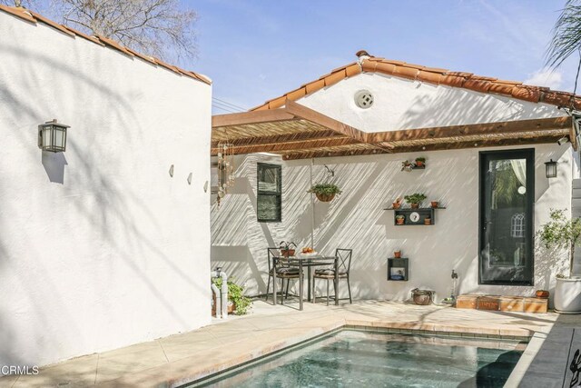 1241 Solita Rd, Pasadena, CA 91103 - rear view of house with an outdoor pool, a patio area, and stucco siding