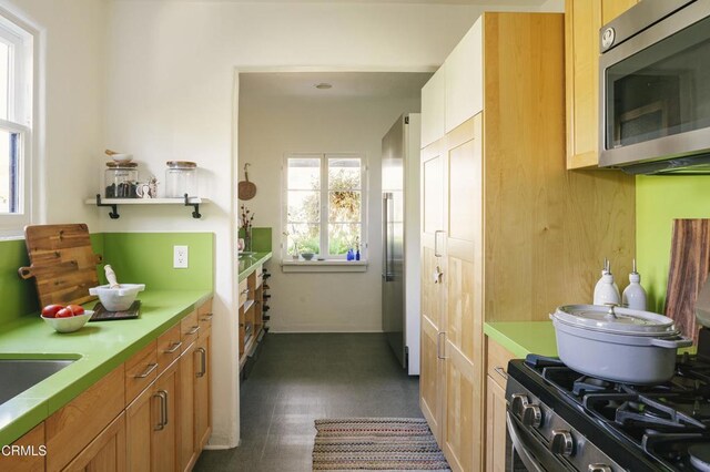 1241 Solita Rd, Pasadena, CA 91103 - kitchen with light countertops, a sink, dark floors, and stainless steel appliances