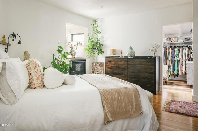 1241 Solita Rd, Pasadena, CA 91103 - bedroom with a closet, a walk in closet, and wood finished floors
