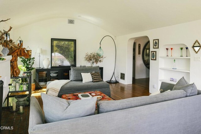 1241 Solita Rd, Pasadena, CA 91103 - living room featuring visible vents, built in features, wood finished floors, arched walkways, and vaulted ceiling