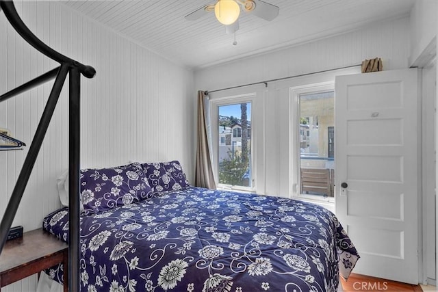117 Maiden Ln, Avalon, CA 90704 - bedroom with a ceiling fan, wood finished floors, and access to exterior