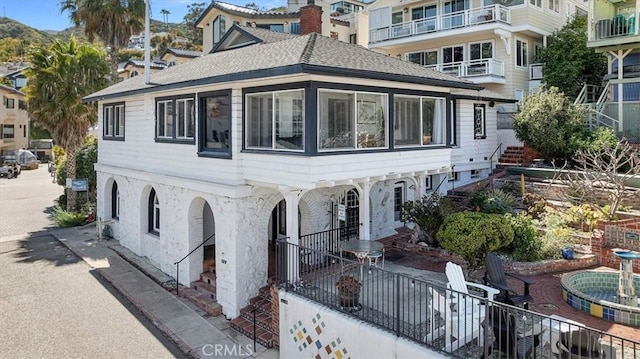 117 Maiden Ln, Avalon, CA 90704 - exterior space with stairway and a shingled roof