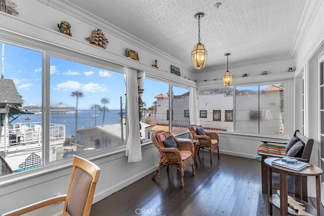 117 Maiden Ln, Avalon, CA 90704 - sunroom with wood-type flooring, a water view, baseboards, and an ornate ceiling