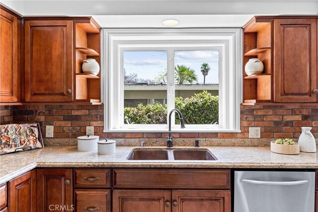 kitchen featuring open shelves, a sink, dishwasher, and a wealth of natural light