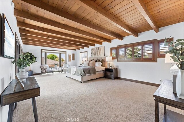 carpeted bedroom with wood ceiling, baseboards, multiple windows, and beam ceiling