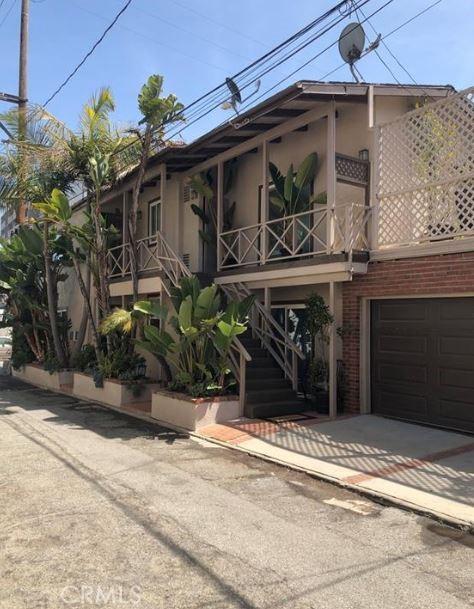3315 Strongs Dr, Venice, CA 90292 - view of front of home featuring a garage, covered porch, and stairway