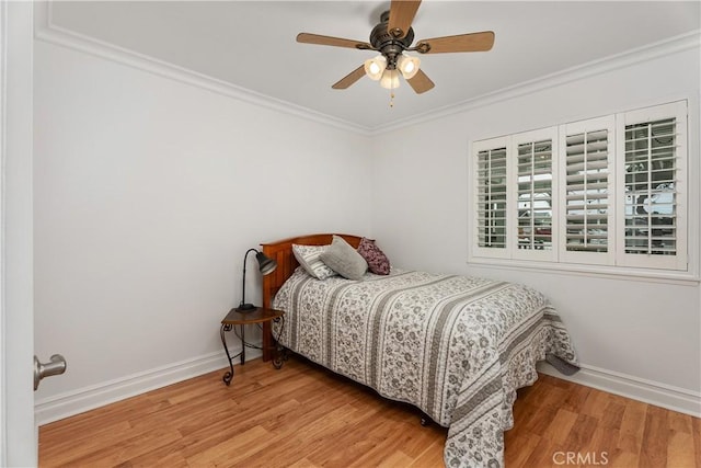 19822 Westwinds Ln, Huntington Beach, CA 92646 - bedroom featuring crown molding, a ceiling fan, baseboards, and wood finished floors