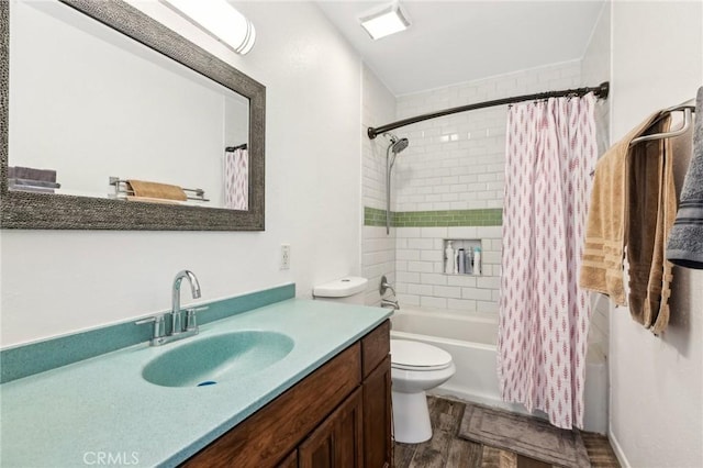 bathroom featuring vanity, toilet, wood finished floors, and shower / tub combo with curtain