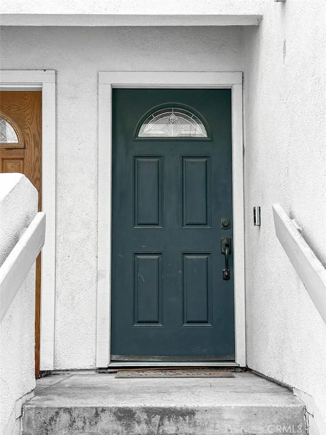 166 N Singingwood St Unit 9, Orange, CA 92869 - property entrance featuring stucco siding