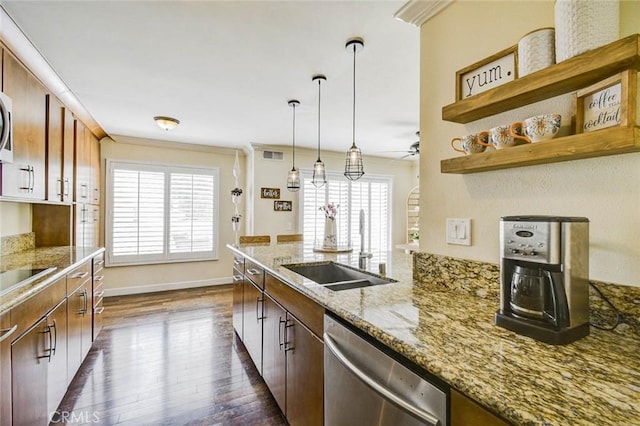 166 N Singingwood St Unit 9, Orange, CA 92869 - kitchen with stainless steel dishwasher, visible vents, dark wood-style flooring, light stone countertops, and a sink