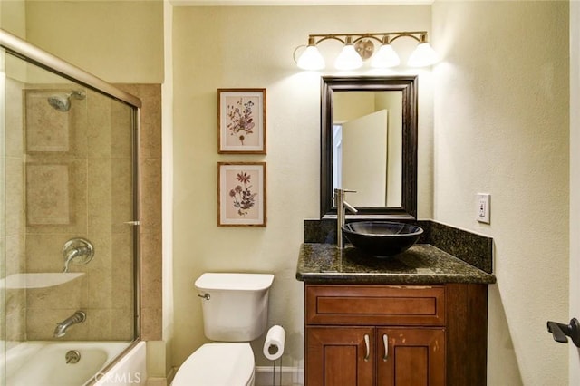 166 N Singingwood St Unit 9, Orange, CA 92869 - bathroom featuring toilet, shower / bath combination with glass door, and vanity