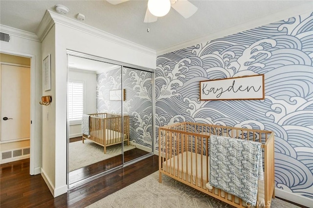 166 N Singingwood St Unit 9, Orange, CA 92869 - bedroom featuring a closet, ornamental molding, hardwood / wood-style floors, and wallpapered walls