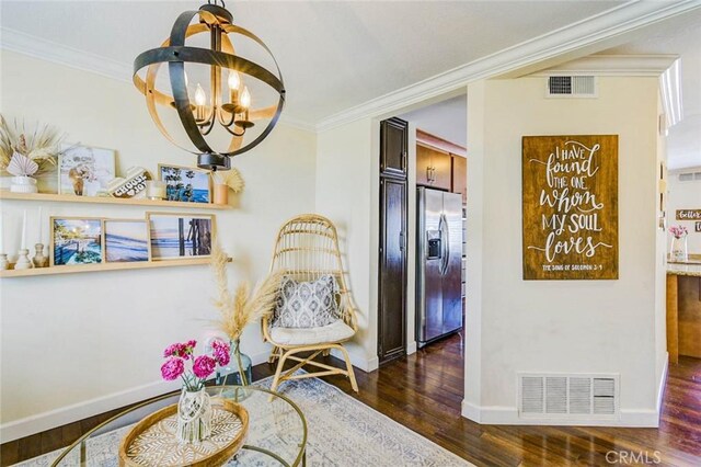 166 N Singingwood St Unit 9, Orange, CA 92869 - sitting room featuring visible vents, crown molding, wood finished floors, baseboards, and a chandelier
