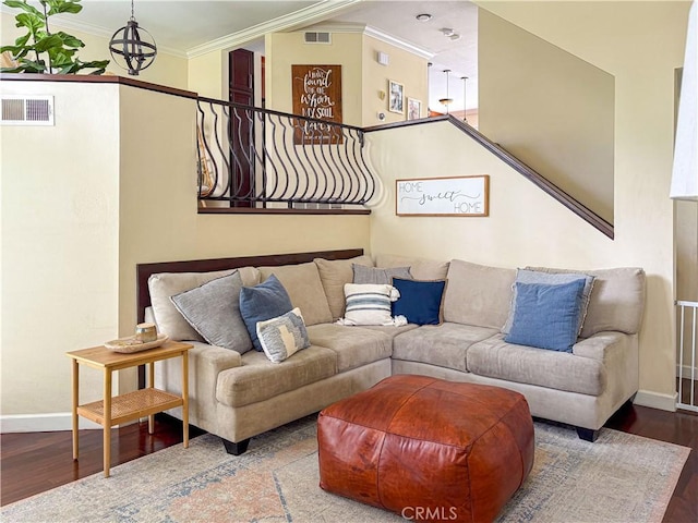 166 N Singingwood St Unit 9, Orange, CA 92869 - living area featuring baseboards, ornamental molding, wood finished floors, and visible vents