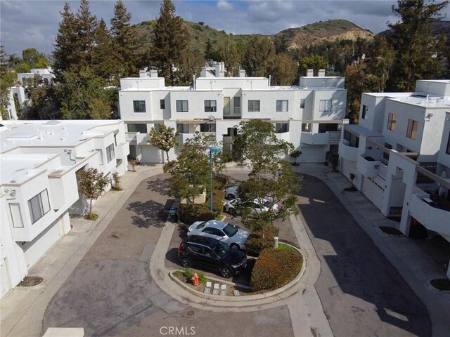 166 N Singingwood St Unit 9, Orange, CA 92869 - aerial view featuring a mountain view and a residential view