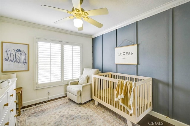 166 N Singingwood St Unit 9, Orange, CA 92869 - bedroom with crown molding, baseboards, a ceiling fan, and a crib