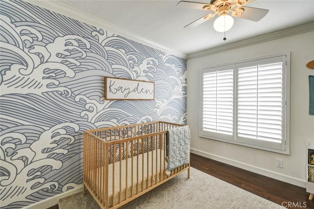 166 N Singingwood St Unit 9, Orange, CA 92869 - bedroom with a nursery area, wood finished floors, baseboards, ornamental molding, and wallpapered walls