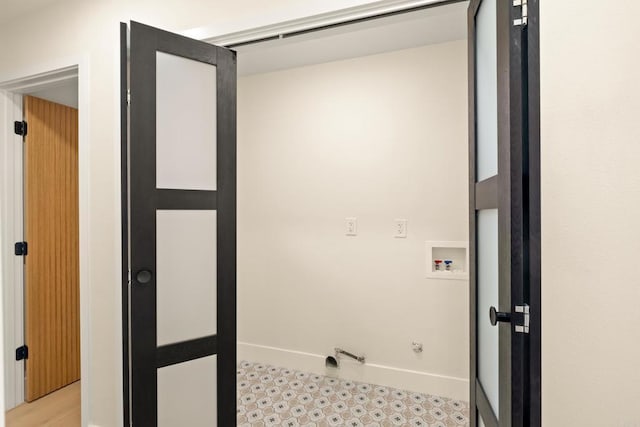 laundry room with hookup for a washing machine, light floors, and hookup for a gas dryer