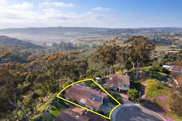 bird's eye view featuring a wooded view