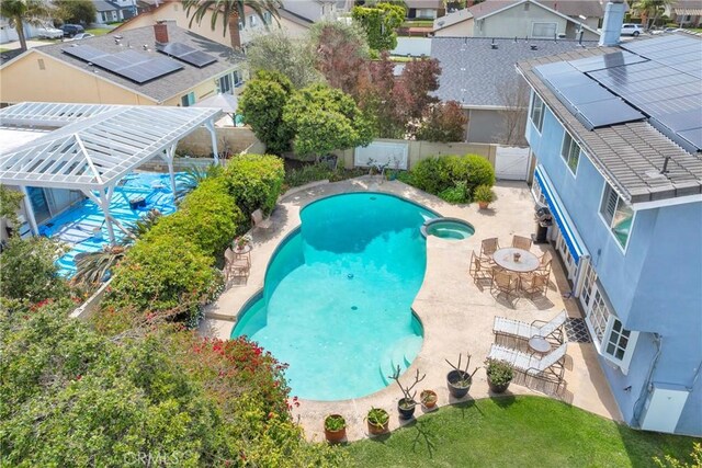 20902 Balgair Cir, Huntington Beach, CA 92646 - view of swimming pool featuring a fenced backyard, a patio, a pool with connected hot tub, and a residential view