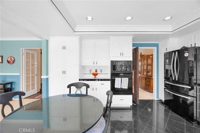 20902 Balgair Cir, Huntington Beach, CA 92646 - kitchen with crown molding, white cabinetry, and black appliances