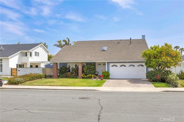 20902 Balgair Cir, Huntington Beach, CA 92646 - view of front of home with an attached garage, fence, driveway, and a tile roof