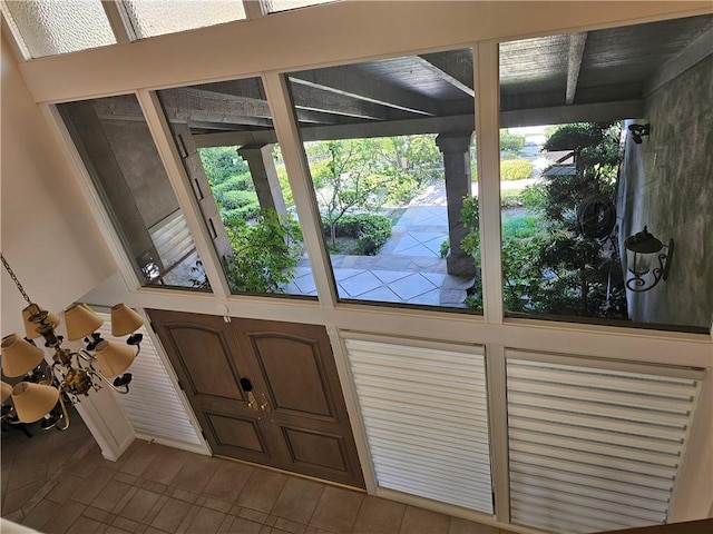 doorway with tile patterned flooring