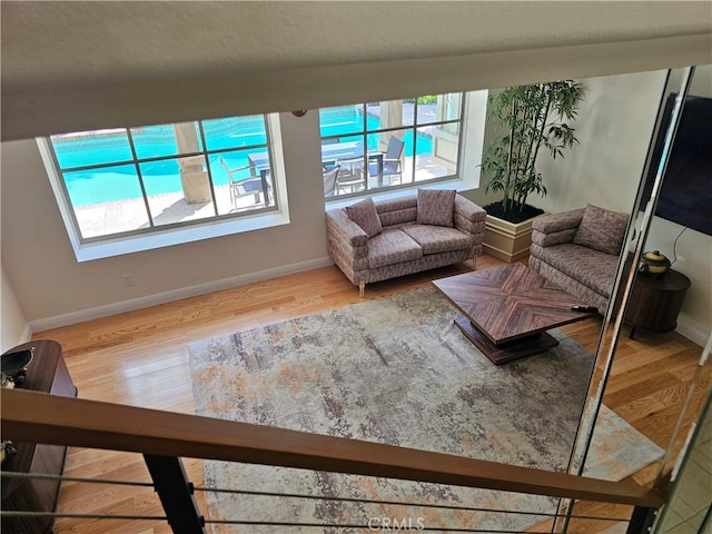 living room featuring baseboards and wood finished floors