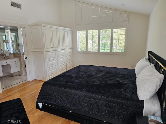 bedroom with visible vents and light wood finished floors
