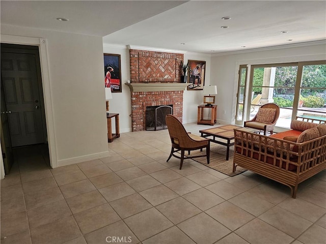 living area featuring crown molding, baseboards, a fireplace, and light tile patterned flooring