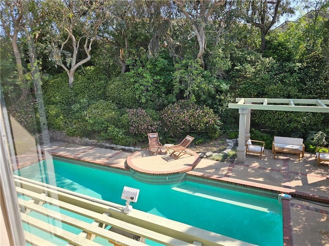 outdoor pool featuring a patio area