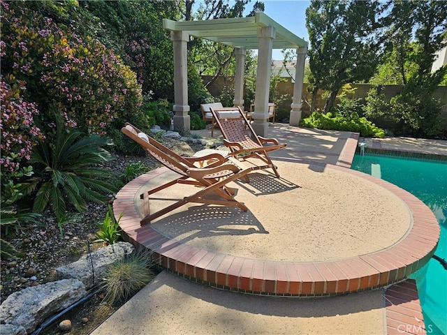 view of patio featuring a fenced backyard and an outdoor pool