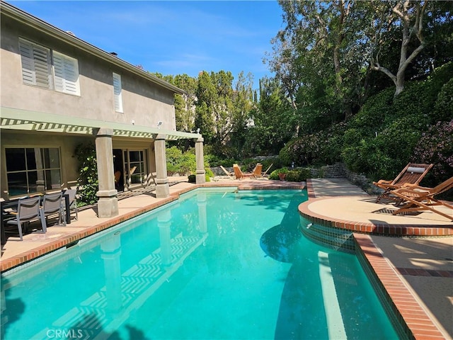 outdoor pool with a patio