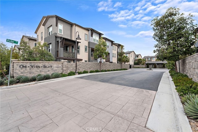 view of street with curbs and a residential view
