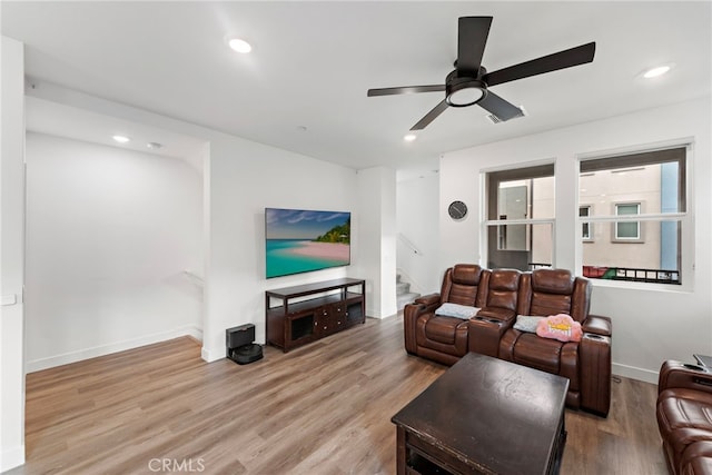 living area featuring stairway, recessed lighting, and wood finished floors