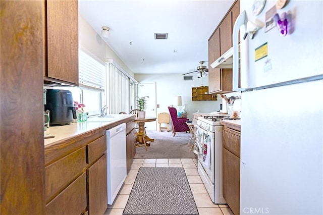 kitchen with light countertops, ceiling fan, white appliances, and visible vents