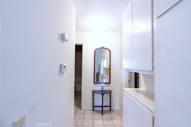 bathroom featuring tile patterned floors and baseboards