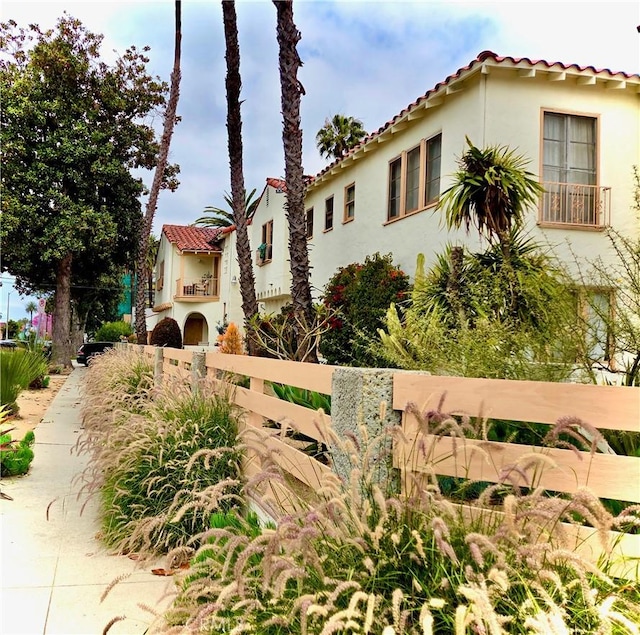 2853 Buckingham Rd, Los Angeles, CA 90016 - mediterranean / spanish home with a tile roof, fence private yard, and stucco siding