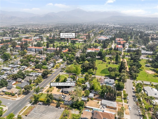 birds eye view of property with a mountain view
