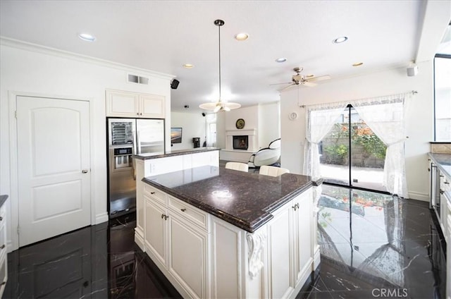 2830 Mount Niguel Cir, Corona, CA 92882 - kitchen with a kitchen island, baseboards, ceiling fan, stainless steel refrigerator with ice dispenser, and recessed lighting
