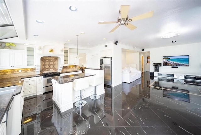 2830 Mount Niguel Cir, Corona, CA 92882 - kitchen with decorative backsplash, marble finish floor, glass insert cabinets, a center island, and appliances with stainless steel finishes