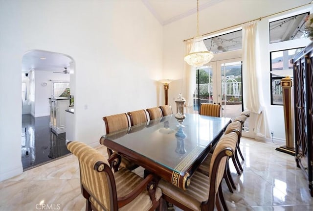 2830 Mount Niguel Cir, Corona, CA 92882 - dining area with arched walkways, french doors, marble finish floor, baseboards, and ornamental molding