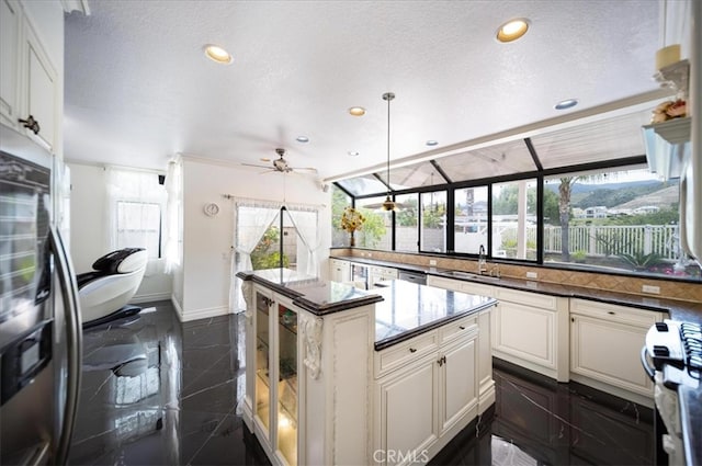 2830 Mount Niguel Cir, Corona, CA 92882 - kitchen featuring a ceiling fan, appliances with stainless steel finishes, a sink, baseboards, and recessed lighting
