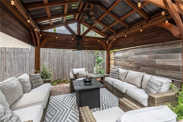 view of patio / terrace with a gazebo, a fenced backyard, and outdoor lounge area